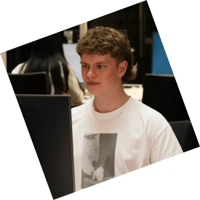 A student using a desktop computer in the campus study centre